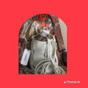 Lia Numa, genuine Italian dollaro-leather, woven beige bucket-style handbag.